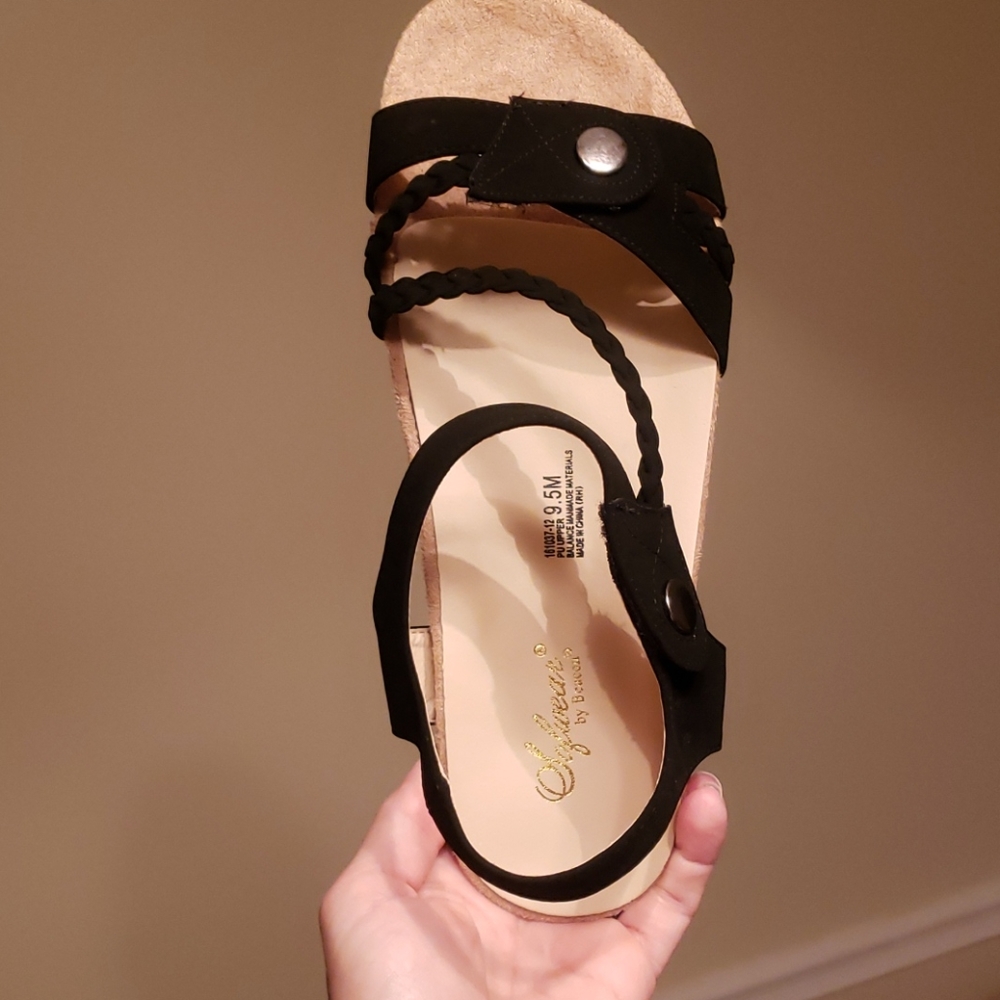 Black sandals size 9.5 fit like 10wide but Velcro straps make comfortable fit
